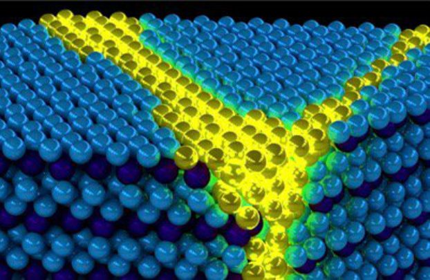 Ilustração mostra excitons coletivas de um sólido excitônico. Essas excitons podem ser pensadas como paredes de domínio de propagação (amarelo) em um fundo de exciton sólido (azul) ordenado de forma diferente (Peter Abbamonte/Departamento de Física da Universidade de Illinois)