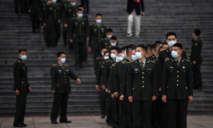 Delegados militares em formação no Grande Salão do Povo em Pequim em 9 de outubro de 2021 (Noel Celis/AFP via Getty Images)