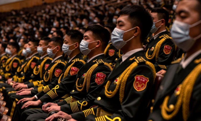 Membros da banda do Exército de Libertação Popular sentados durante a Cerimônia de Abertura do 20º Congresso Nacional do Partido Comunista da China no Grande Salão do Povo em 16 de outubro de 2022 em Pequim, China. Kevin Frayer/Getty Images
