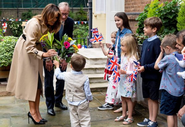 First Lady Melania Trump (L) and Philip May (R), husband of Britain's Prime Minister Theresa May, attend a garden party 