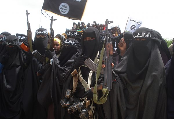 Somali women carry weapons during a demonstration organized by the islamist al-Shabab group in Suqa Holaha neighborhood of Mogadishu, on July 5, 2010. (Abdurashid Abikar/AFP/Getty Images)