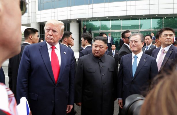 North Korean leader Kim Jong Un, U.S. President Donald Trump, and South Korean President Moon Jae-in inside the demilitarized zone 