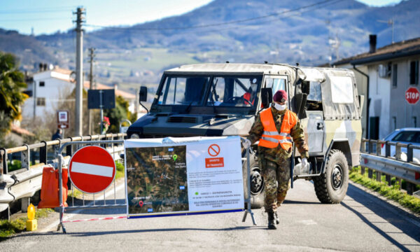 An Italian army soldier blocks off a road in Italy